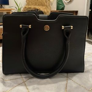 Chic black bag with grey leopard print on the sides